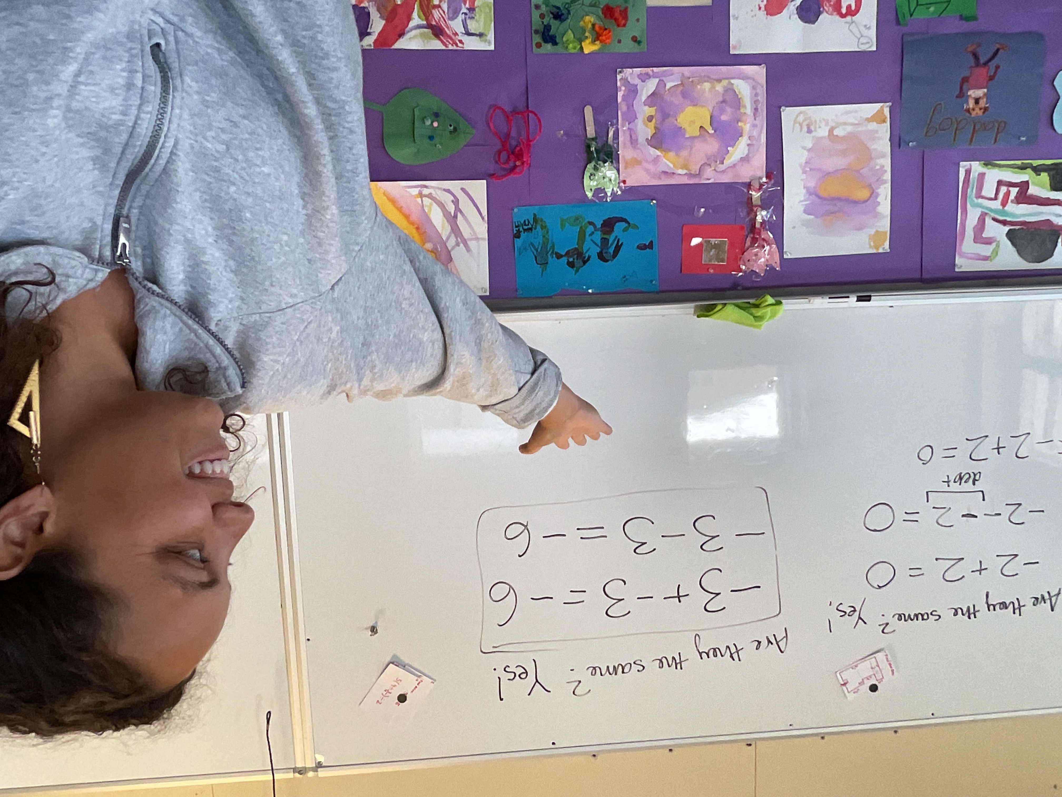 Ms. Holt teaching at the whiteboard